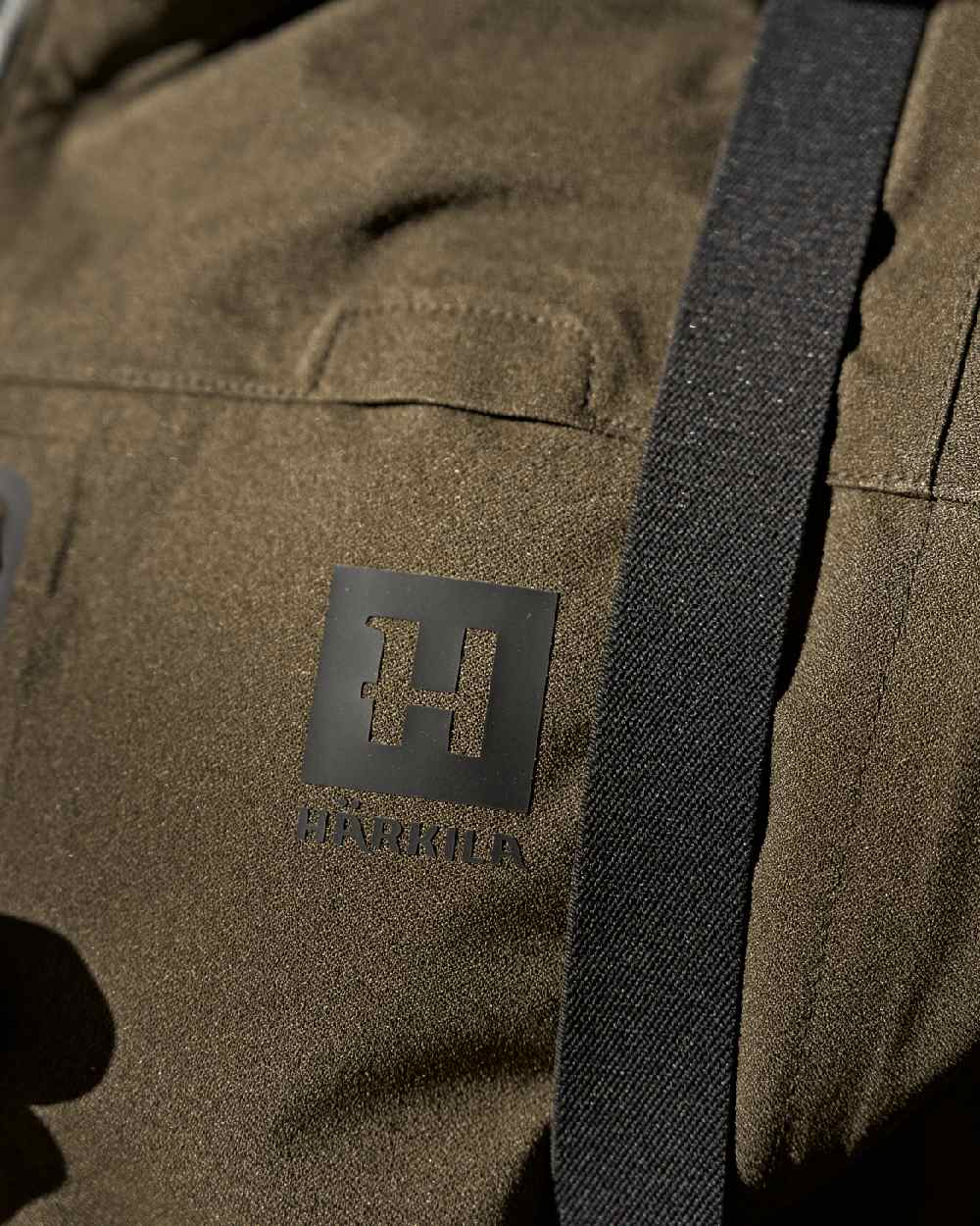 Hunting Green Coloured Harkila Finnmark HWS Jacket on blurry background
