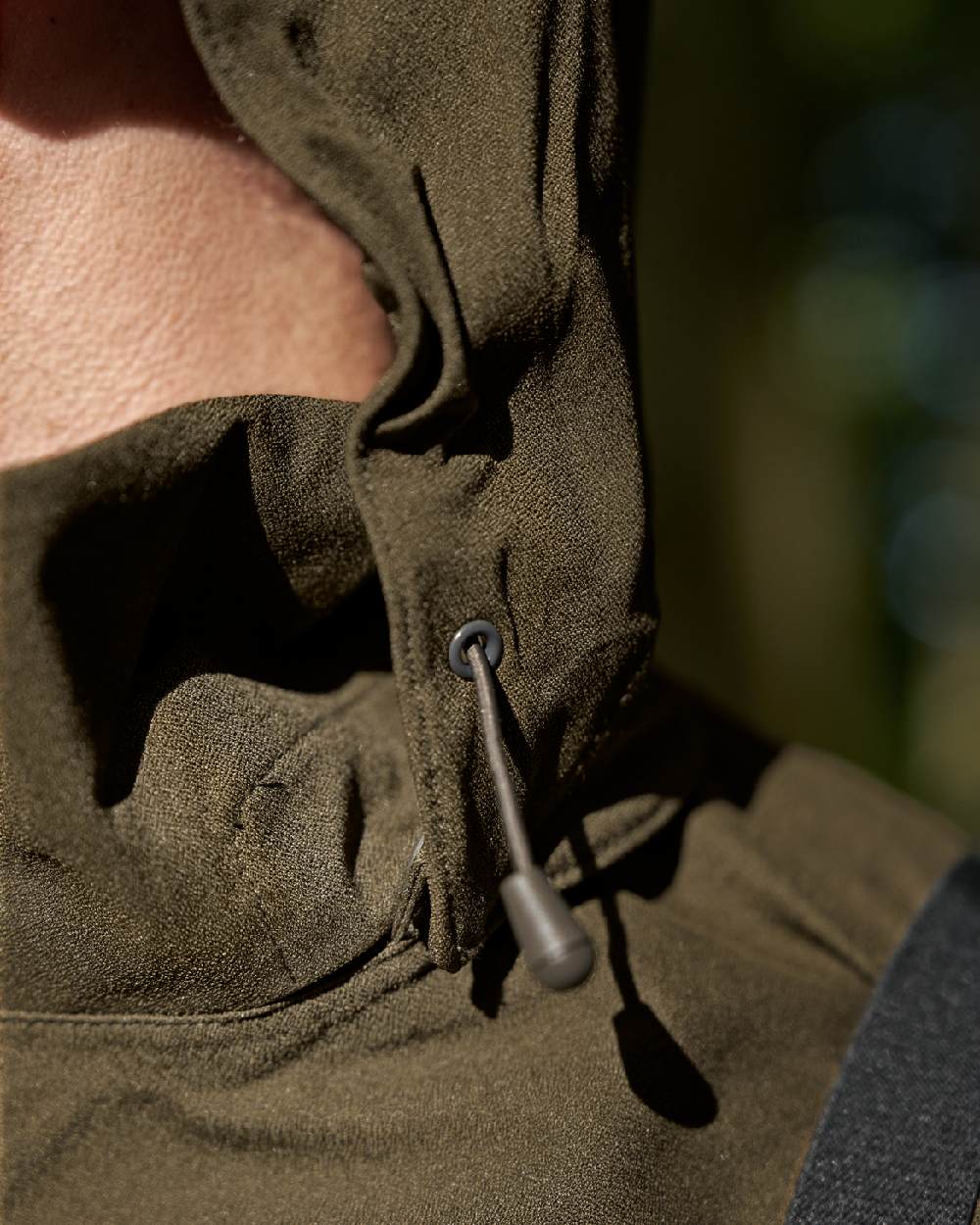 Hunting Green Coloured Harkila Finnmark HWS Jacket on blurry background