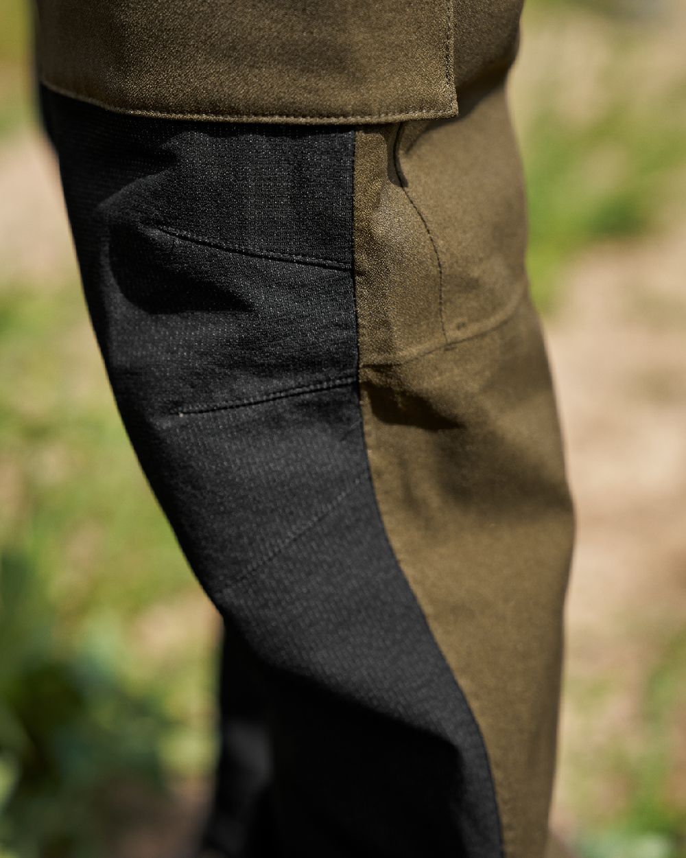 Hunting Green Coloured Harkila Finnmark HWS Trousers on blurry background