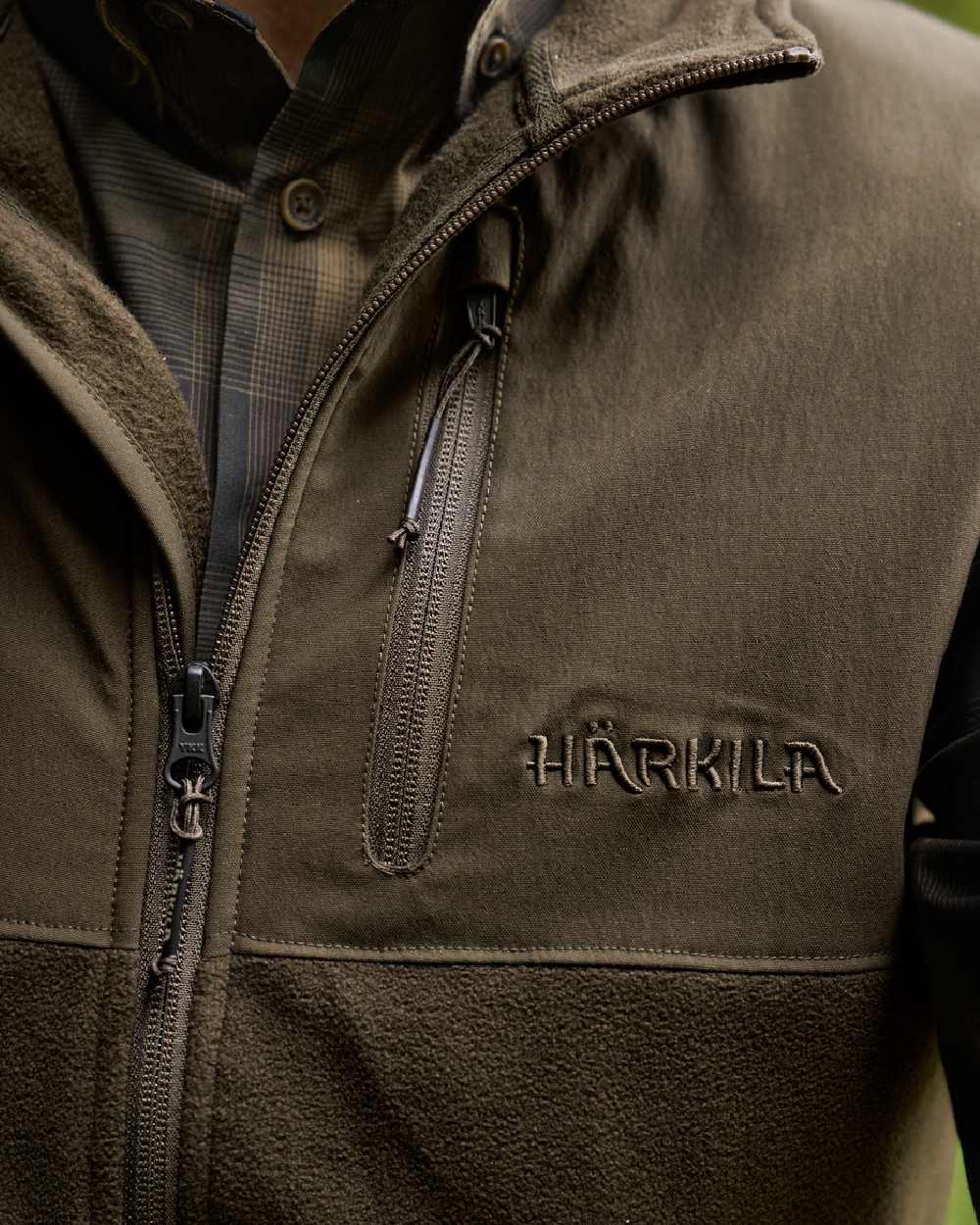 Hunting Green Willow Green Coloured Harkila Fjell Fleece Waistcoat on blurry background