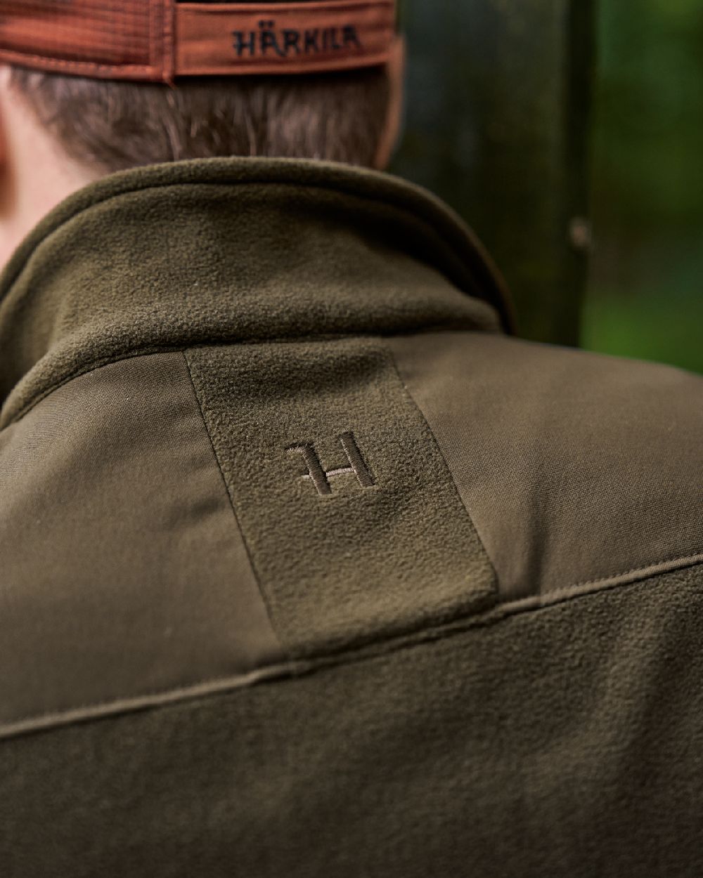 Hunting Green Willow Green Coloured Harkila Fjell Fleece Waistcoat on blurry background