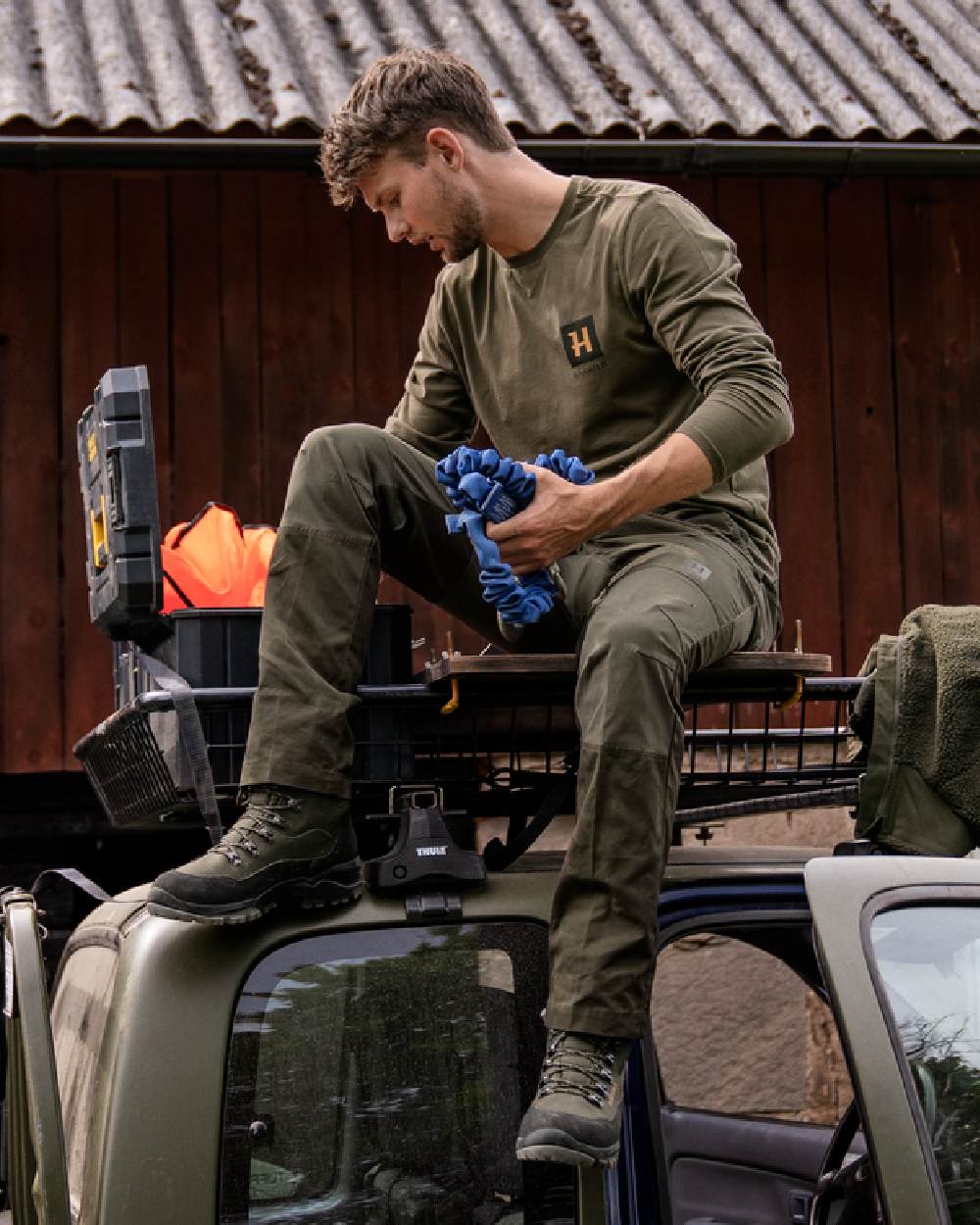 Forest Night Rosin Coloured Harkila Fjell Trousers on outdoor background