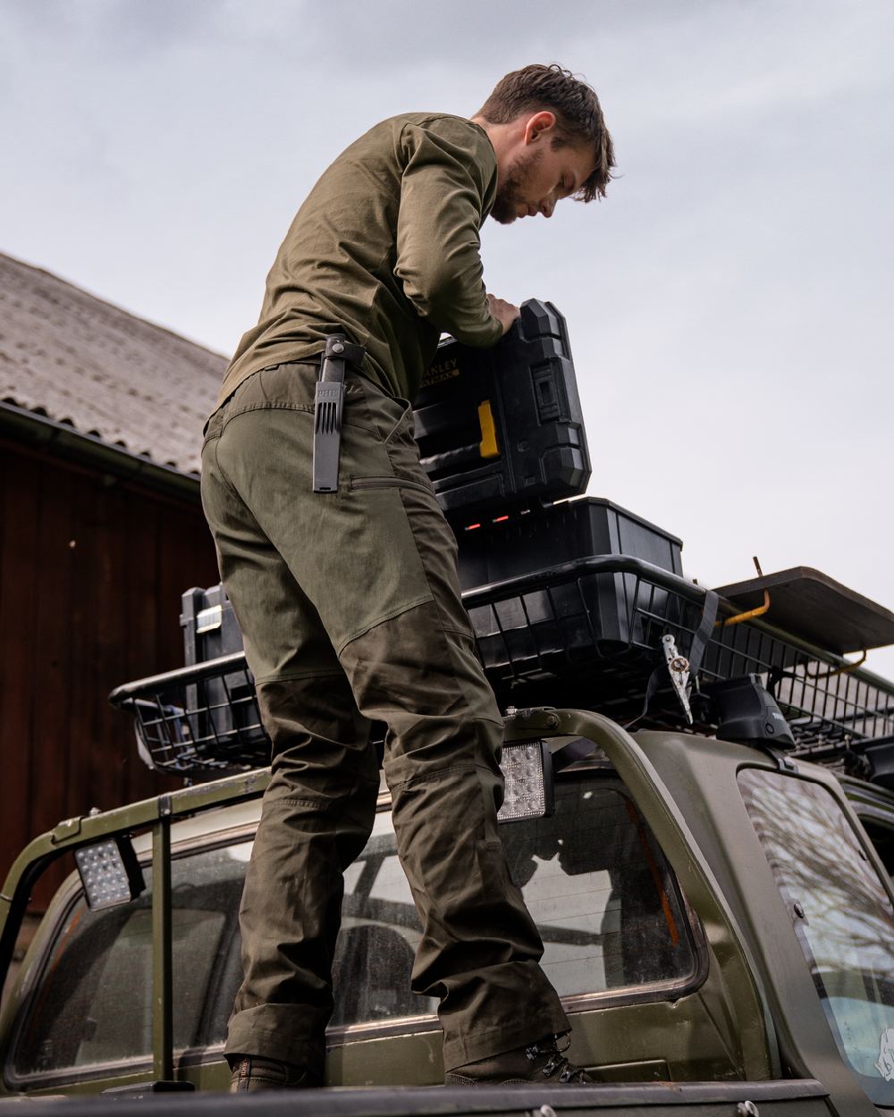 Forest Night Rosin Coloured Harkila Fjell Trousers on outdoor background