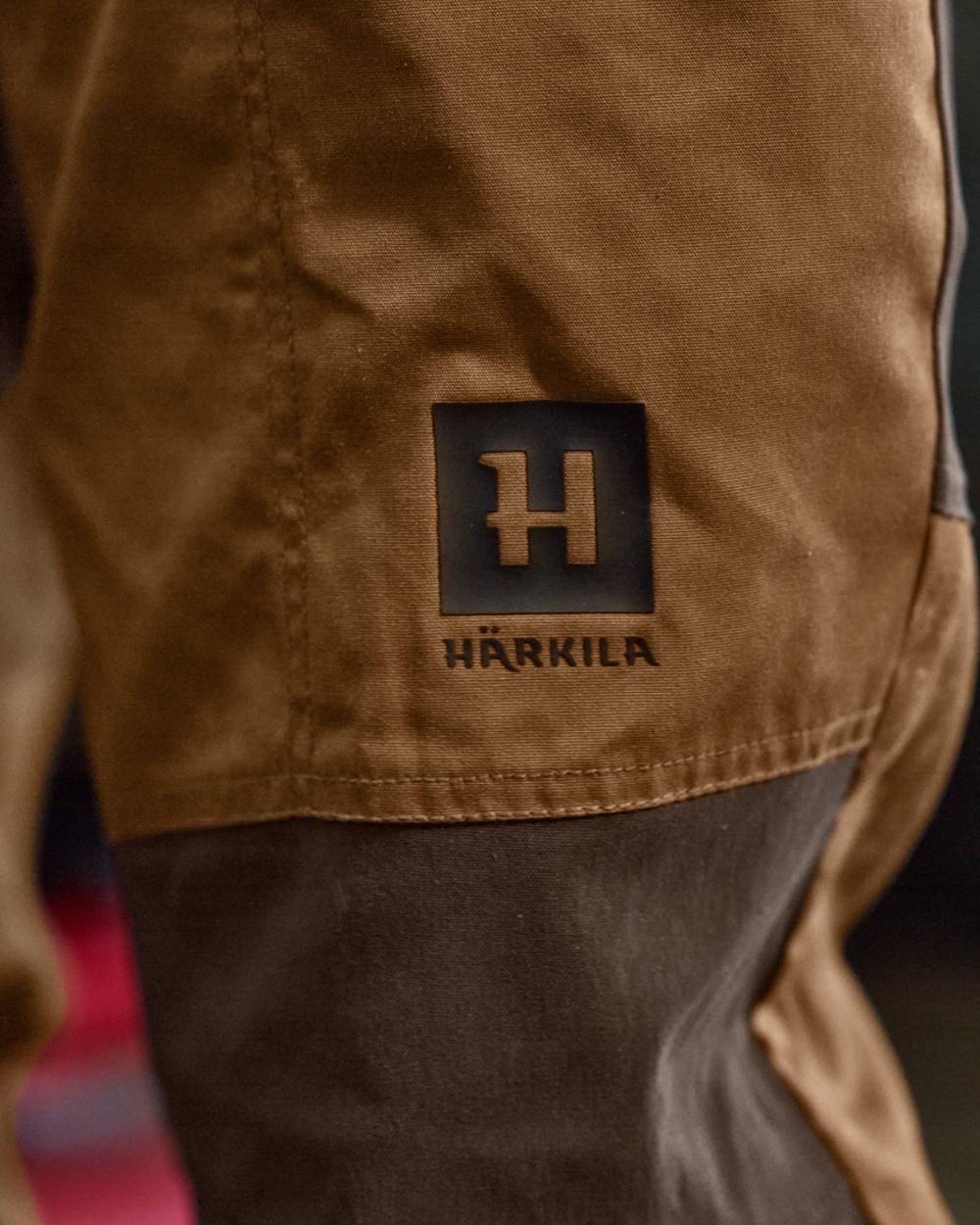 Rustique Clay Brown Coloured Harkila Fjell Trousers on factory background