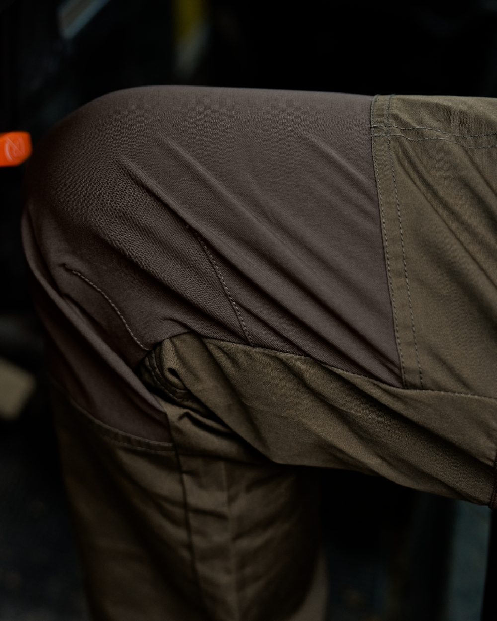 Willow Green Shadow Brown Coloured Harkila Fjell Trousers on blurry background