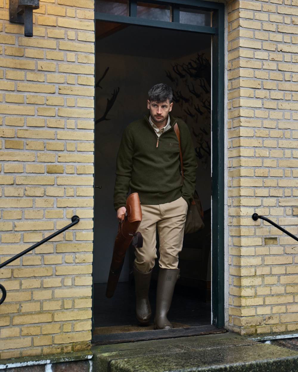 Dark Willow Green Coloured Harkila Forester Gusset Rubber Boots on outdoor background