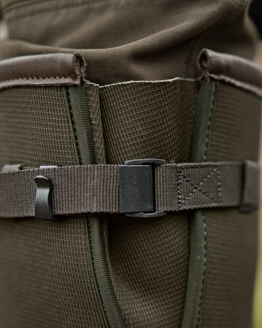 Willow Green Deep Brown Coloured Harkila Forester Zip Rubber Boot on outdoor background