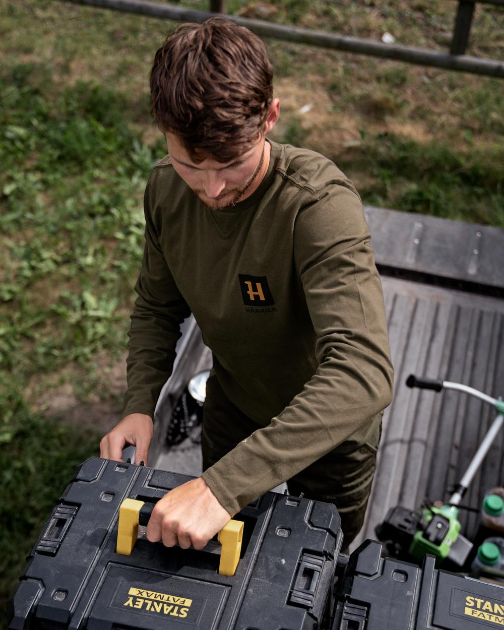 Willow Green Coloured Harkila Gorm Long Sleeve T-Shirt on outdoor background