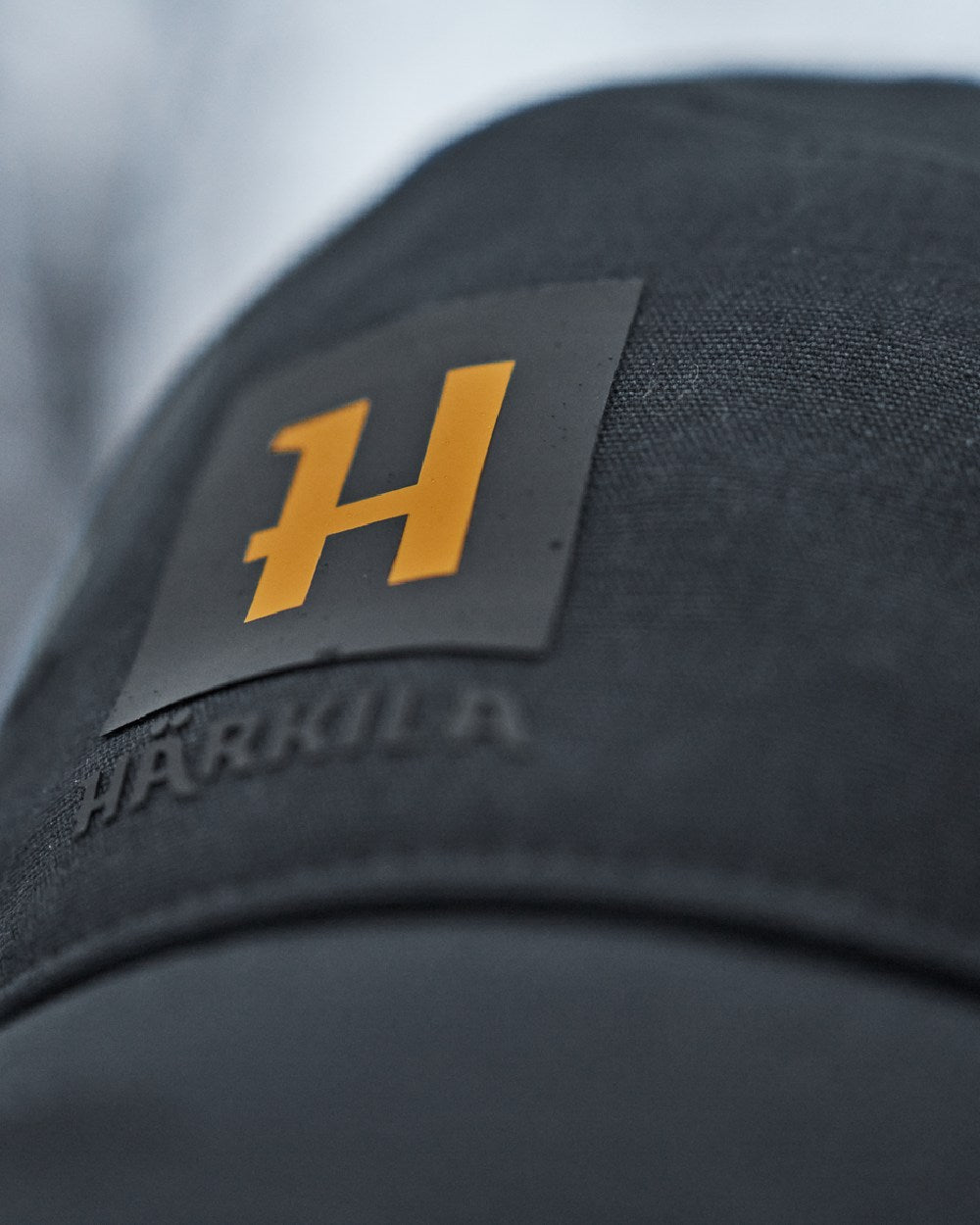 Dark Navy Coloured Harkila Instinct Cap on blurry background
