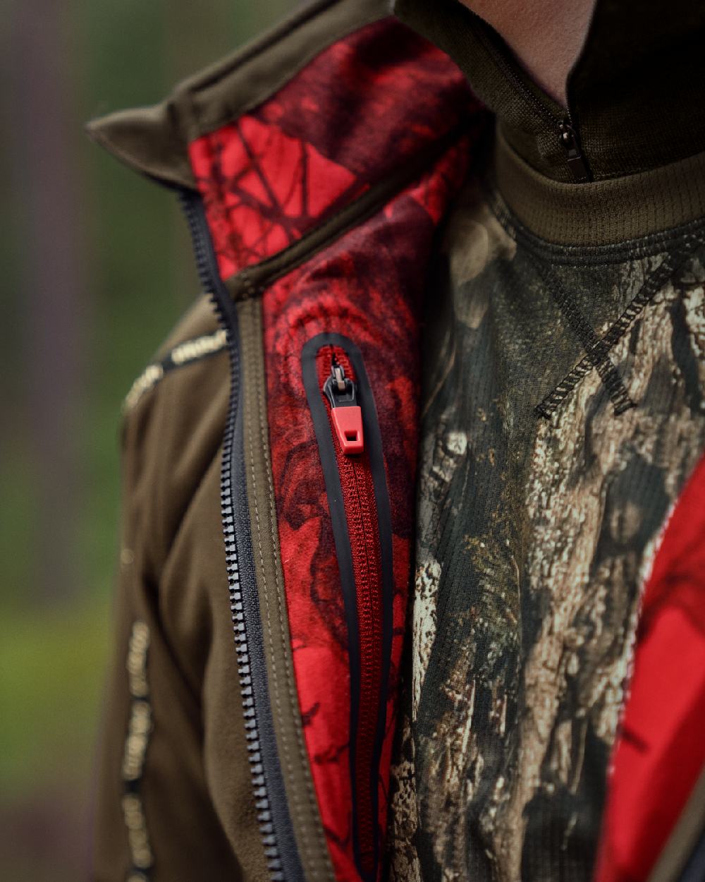 Hunting Green Mossy Oak Break-up Country Coloured Harkila Kamko Camo Reversible WSP Jacket on blurry background
