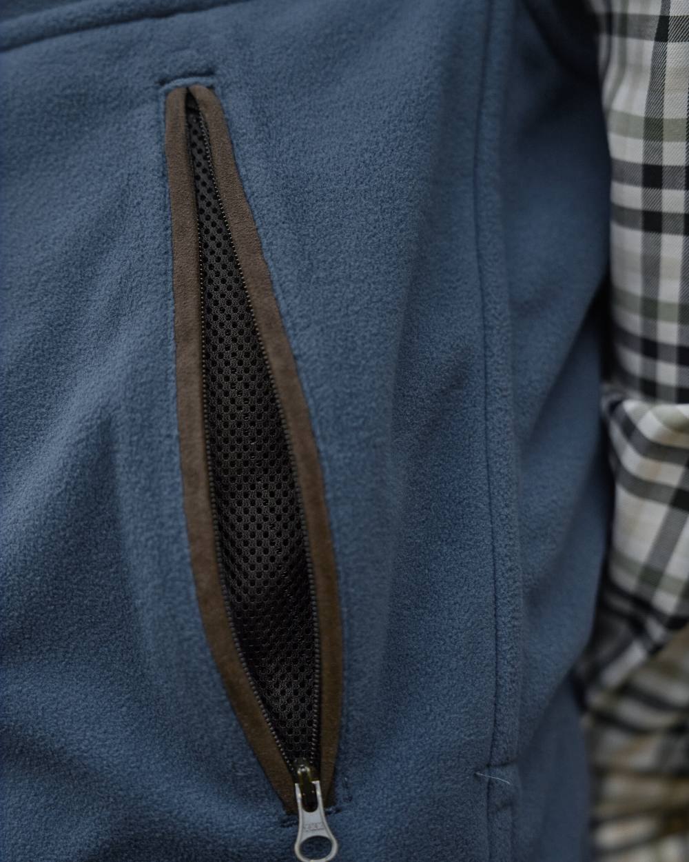 Dark Olive Sea Blue Coloured Harkila Kamko Estate WSP Reversible Waistcoat on outdoor background