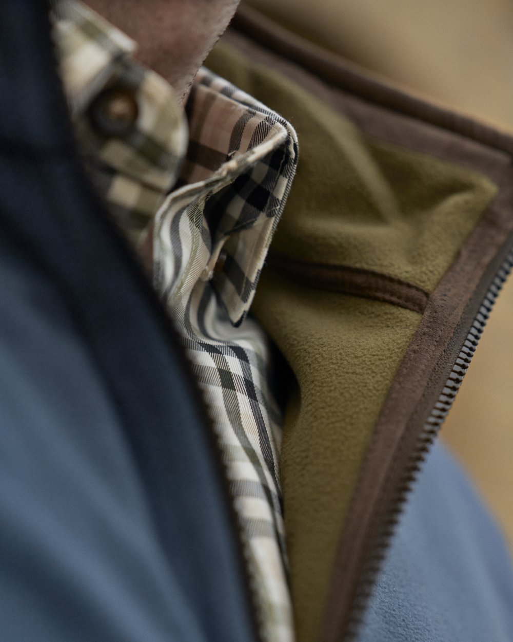 Dark Olive Sea Blue Coloured Harkila Kamko Estate WSP Reversible Waistcoat on outdoor background