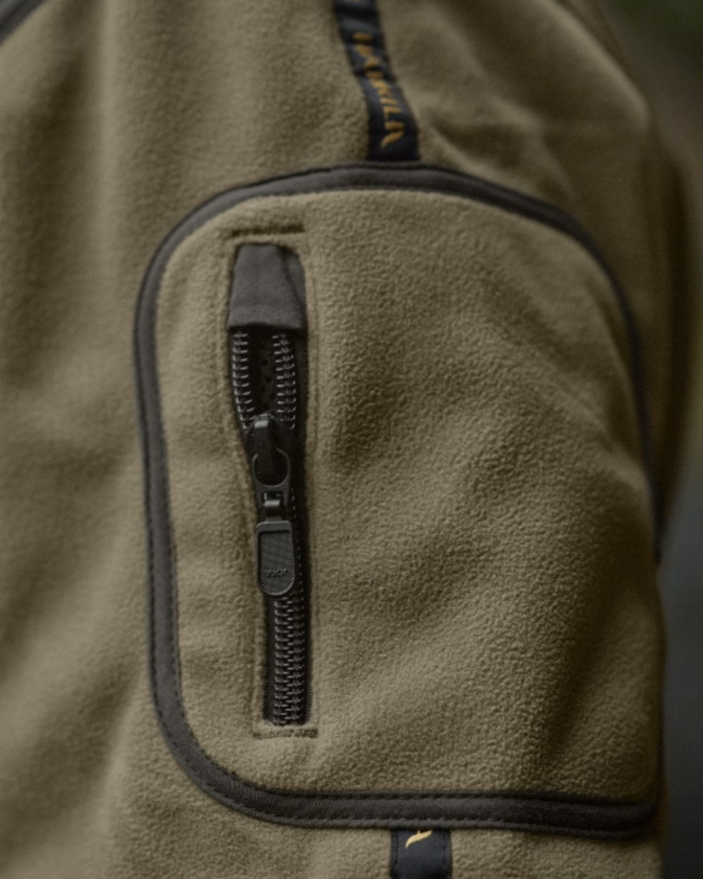 Dark Antique Bronze Willow Green Coloured Harkila Kamko Fleece on outdoor background