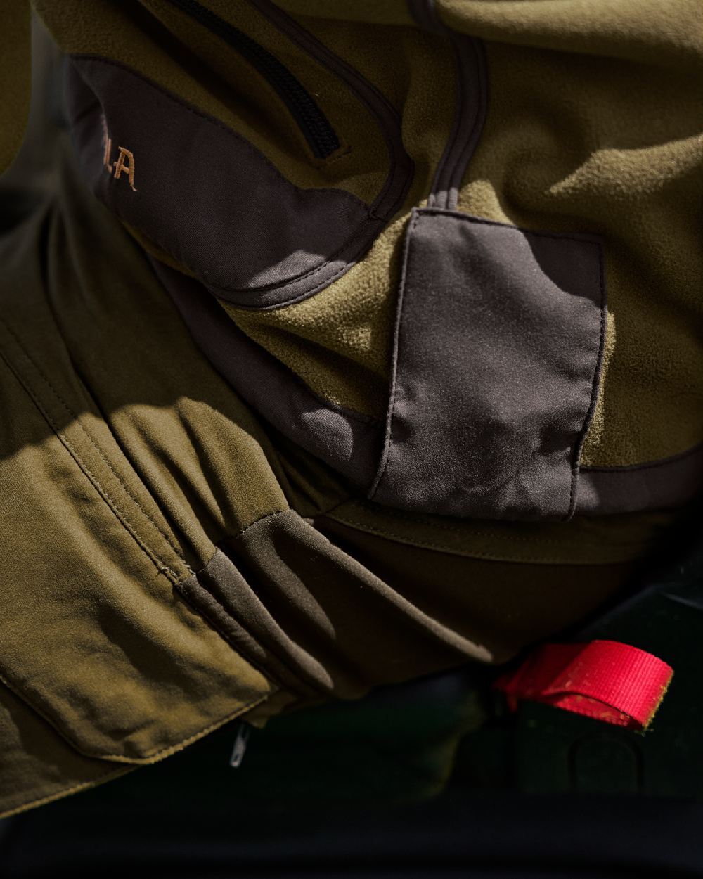 Dark Olive Arabian Spice Coloured Harkila Kamko Fleece on outdoor background