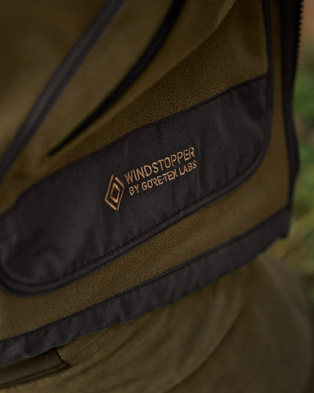 Dark Olive Arabian Spice Coloured Harkila Kamko Fleece on outdoor background