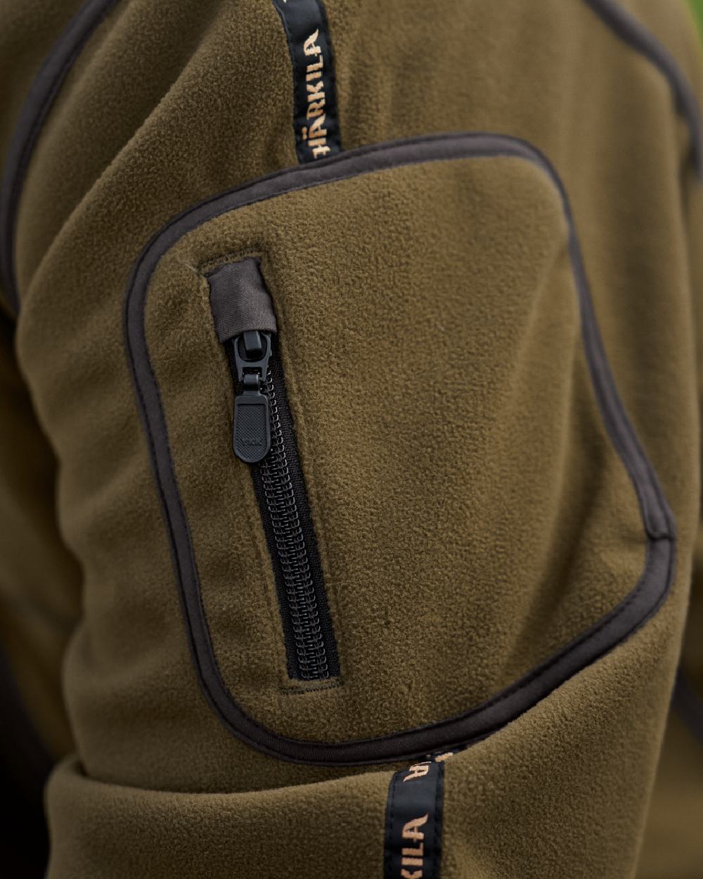 Dark Olive Arabian Spice Coloured Harkila Kamko Fleece on outdoor background