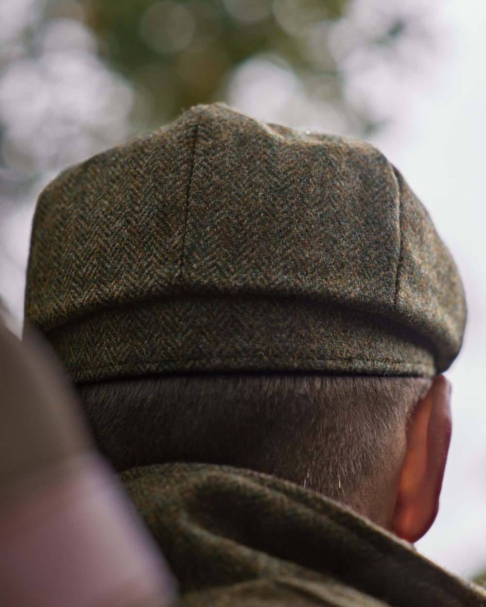 Forest Green Herringbone Coloured Harkila Kenmore Classic Baker Boy Cap on forest background