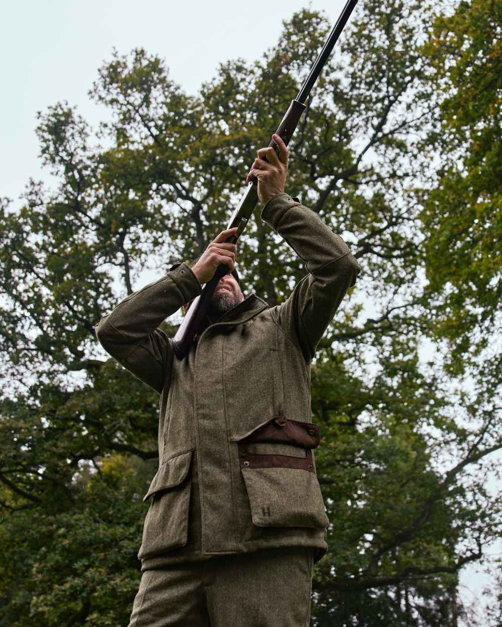 Forest Green Herringbone Coloured Harkila Kenmore GTX Jacket on forest background