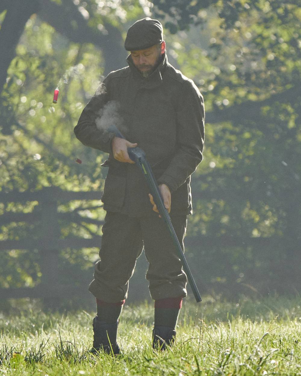 Forest Green Herringbone Coloured Harkila Kenmore GTX Jacket on forest background