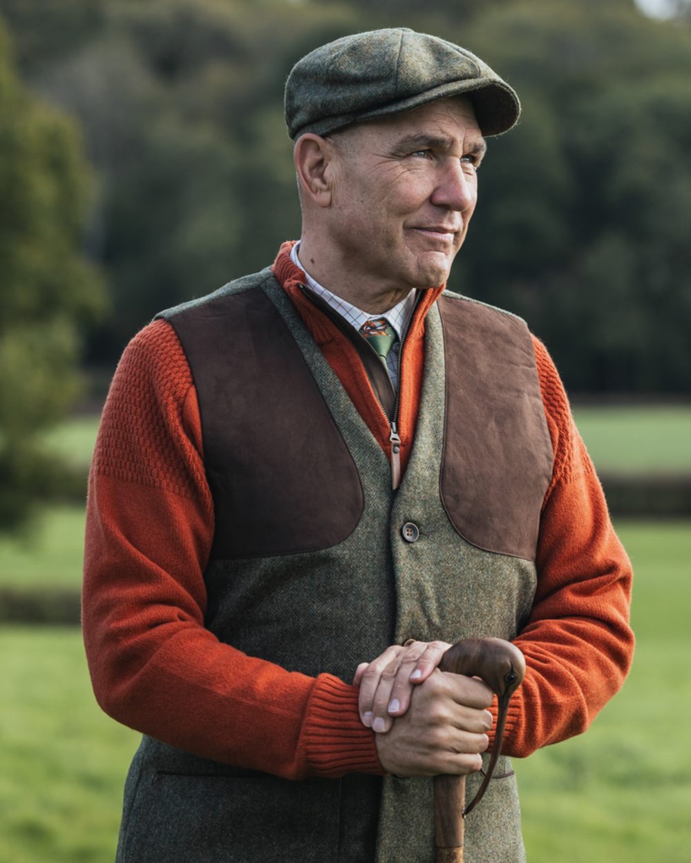 Forest Green Herringbone coloured Harkila Kenmore Shooting Waistcoat on forest background