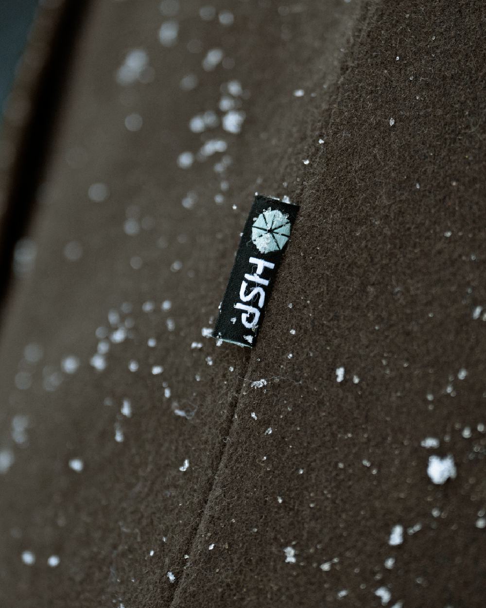 Dark Hunting Green Shadow Brown coloured Harkila Kodiak CleverWool HSP Insulated Jacket close up