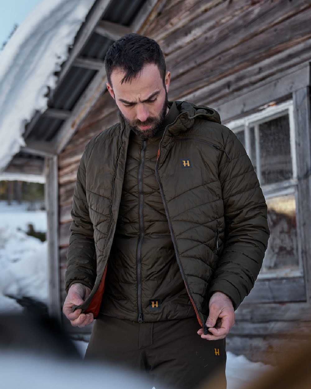 Willow Green Coloured Harkila Logmar Insulated Packable Waistcoat on outdoor background