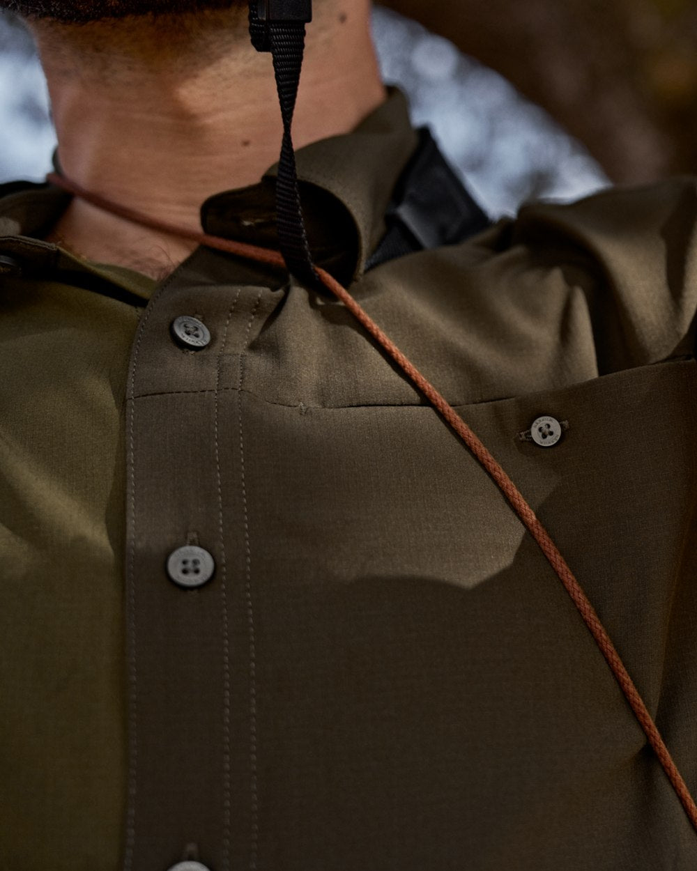 Dark Olive Willow Green Coloured Harkila Kenmore Cl. Flat Cap on forest background
