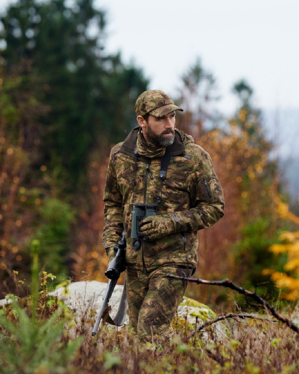 Axis MSP Forest Coloured Harkila Lynx Cap on forest background