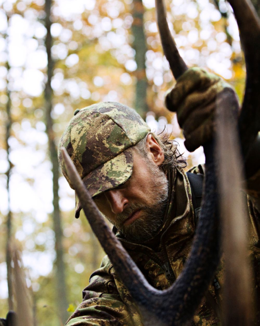 Axis MSP Forest Coloured Harkila Lynx Cap on forest background