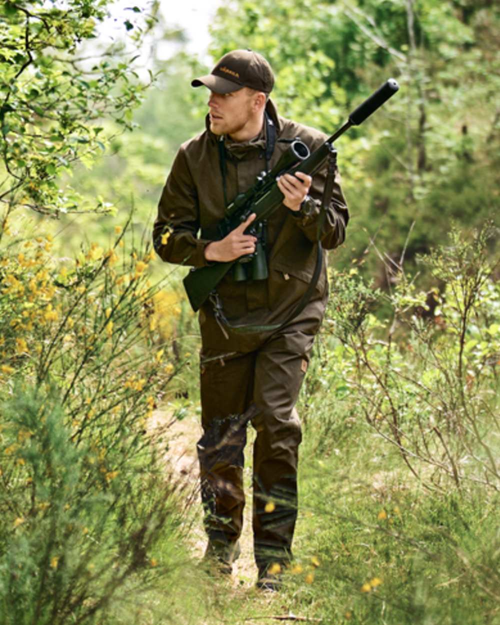 Willow Green coloured Harkila Mens Fjell Ace Trousers on forest background