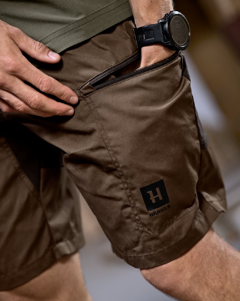 Dark Earth Shadow Brown Coloured Harkila Mens Fjell Shorts on studio background