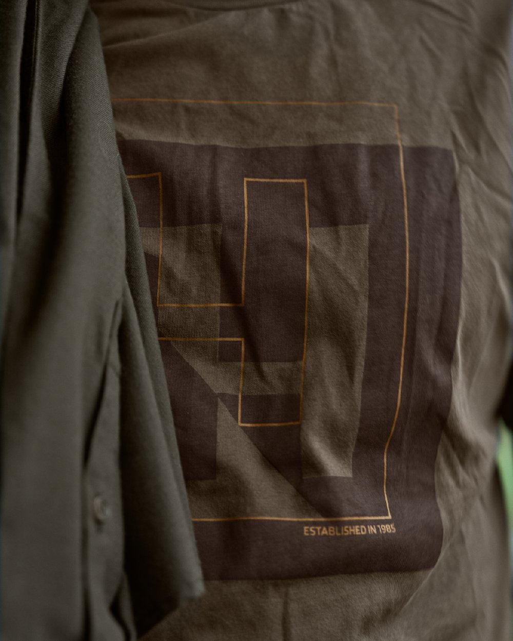 Major Brown Coloured Harkila Mens H-logo Short Sleeve T-Shirt on blurry background