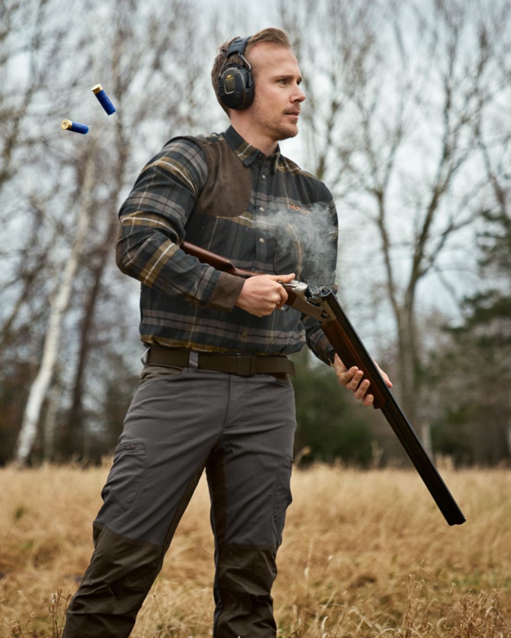 Dark Olive coloured Harkila Mens Jarne Shooting Shirt on forest background