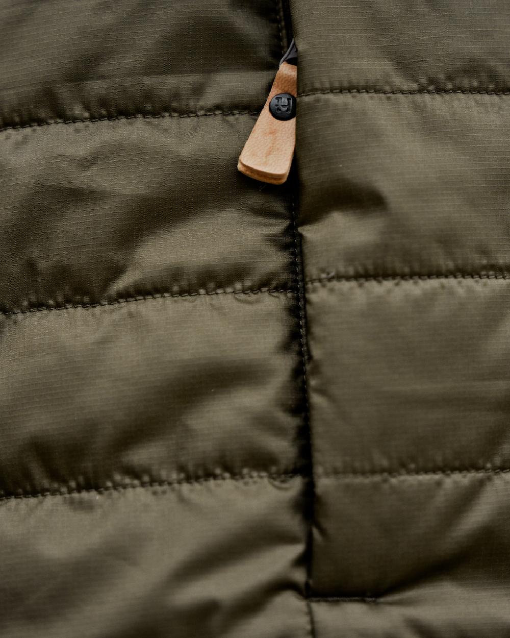 Willow Green Sea Blue Coloured Harkila Mens Kalix HSP Jacket on blurry background