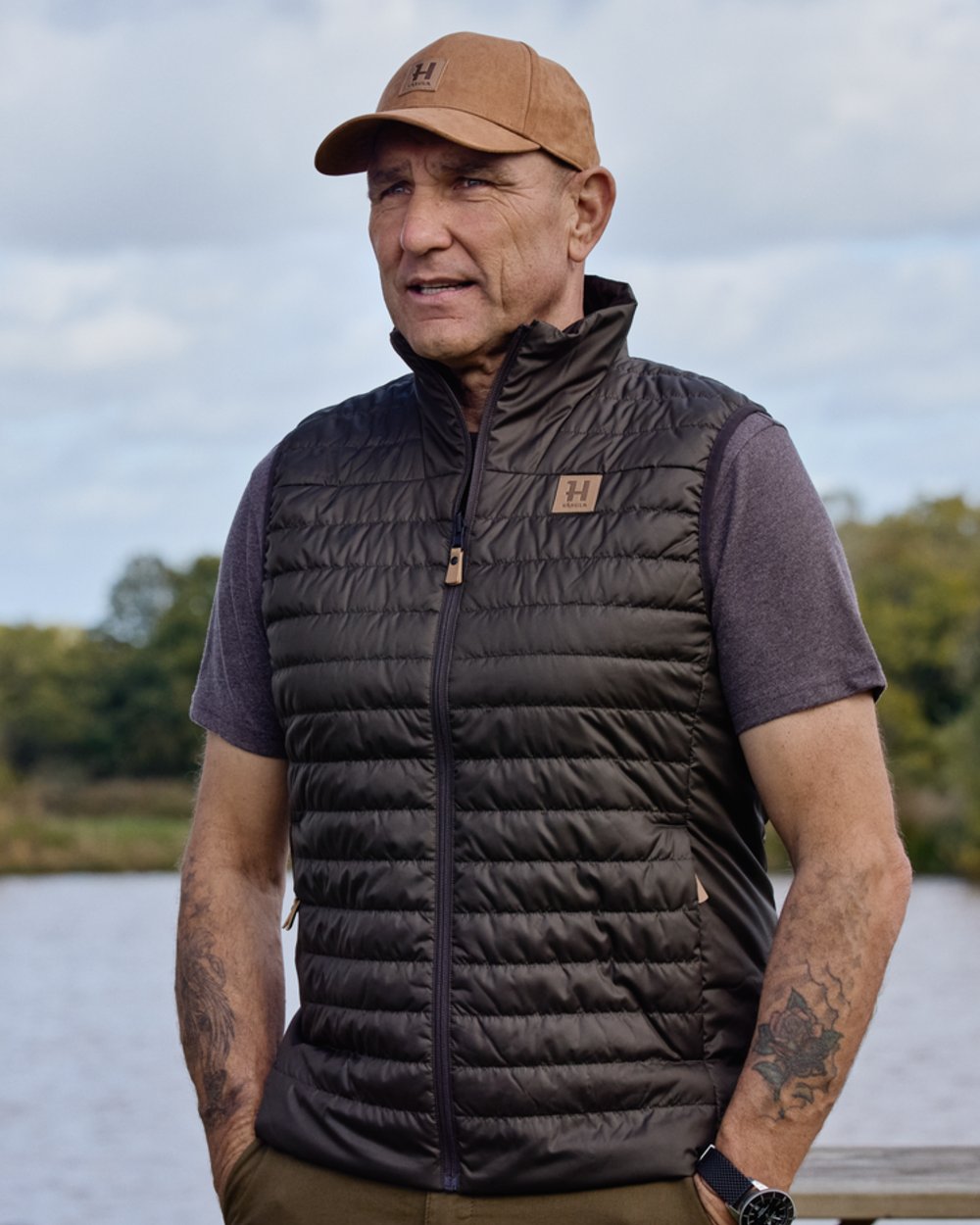 Willow Green Shadow Brown coloured Harkila Mens Kalix HSP Waistcoat on outdoor background