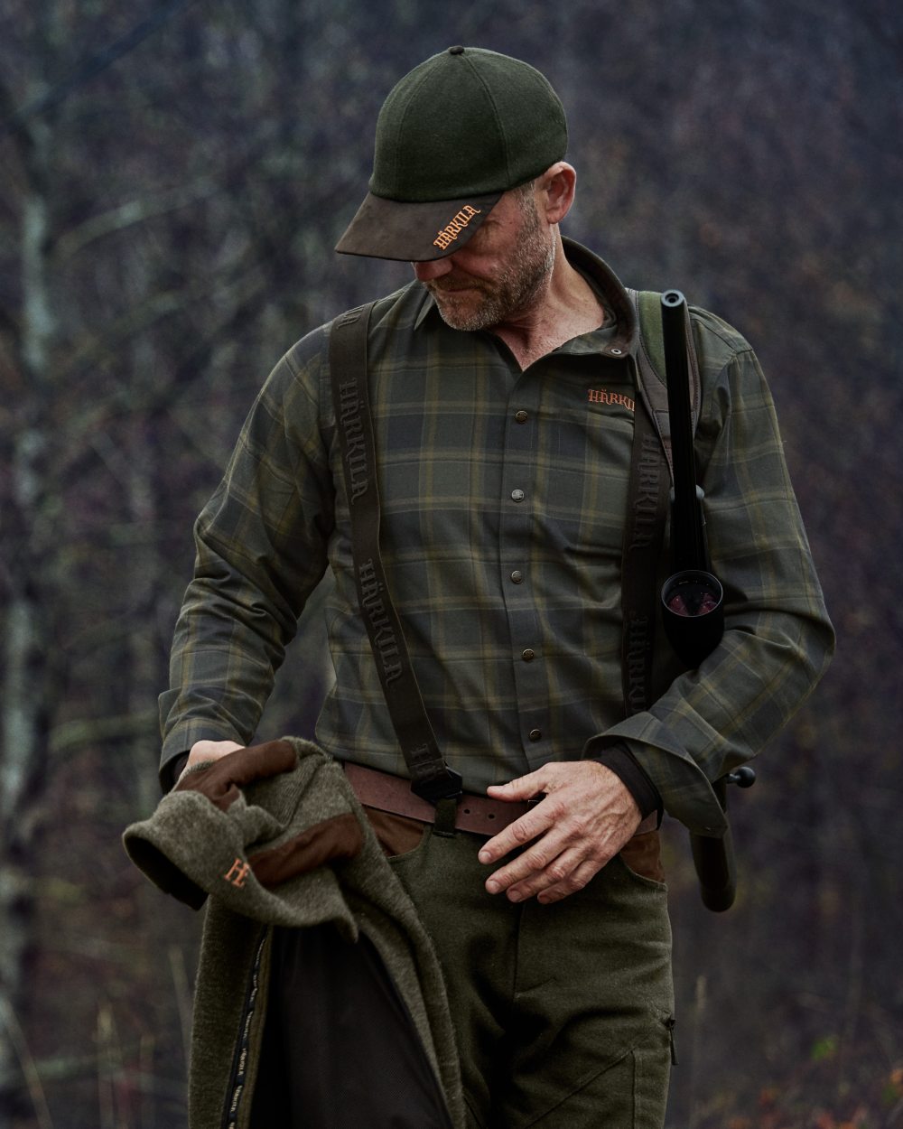Willow Green Check colour Harkila Metso Active Shirt on blurry background