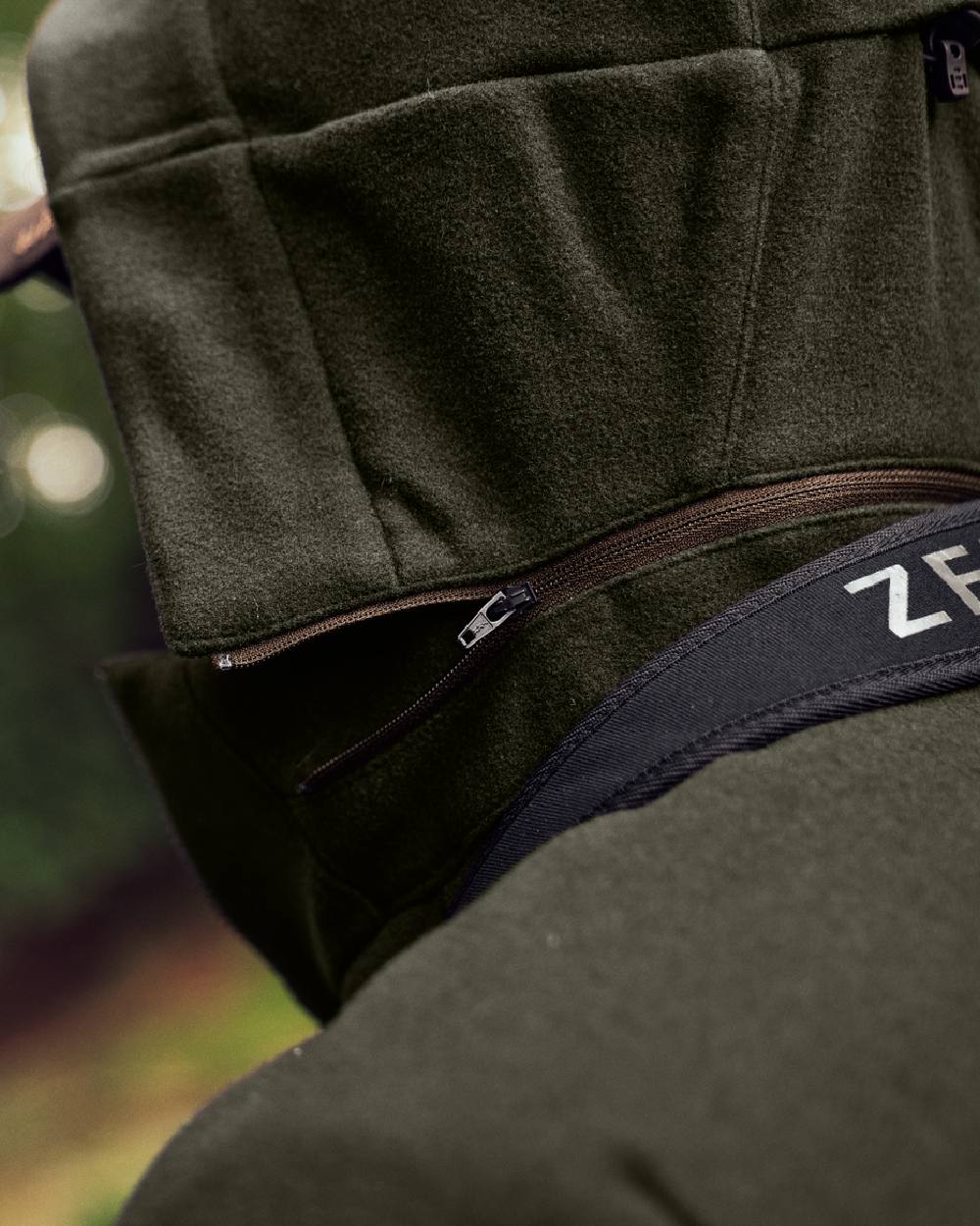 Willow Green Coloured Harkila Metso Hybrid Jacket on forest background