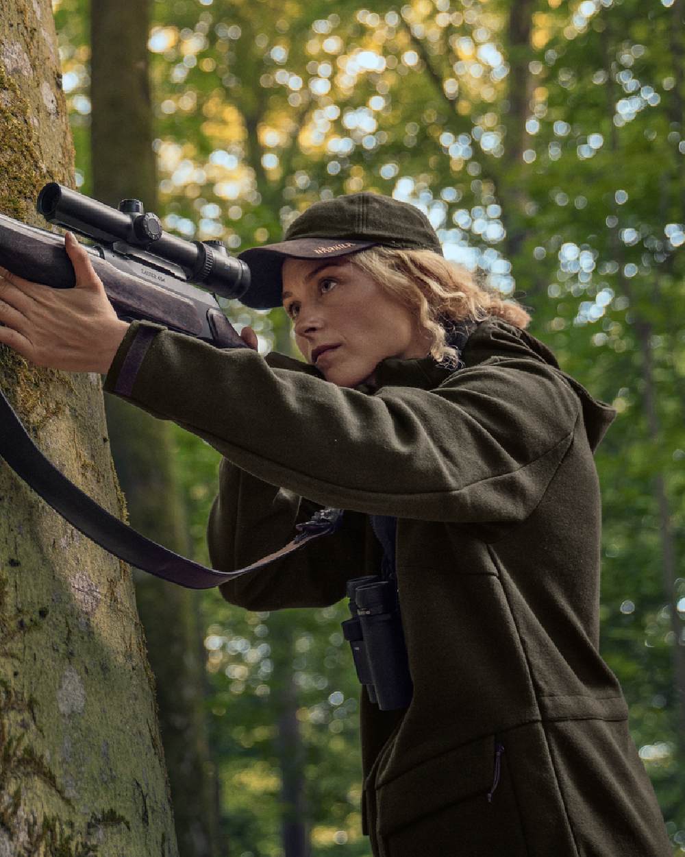 Willow Green Coloured Harkila Metso Womens Hybrid Jacket on outdoor background