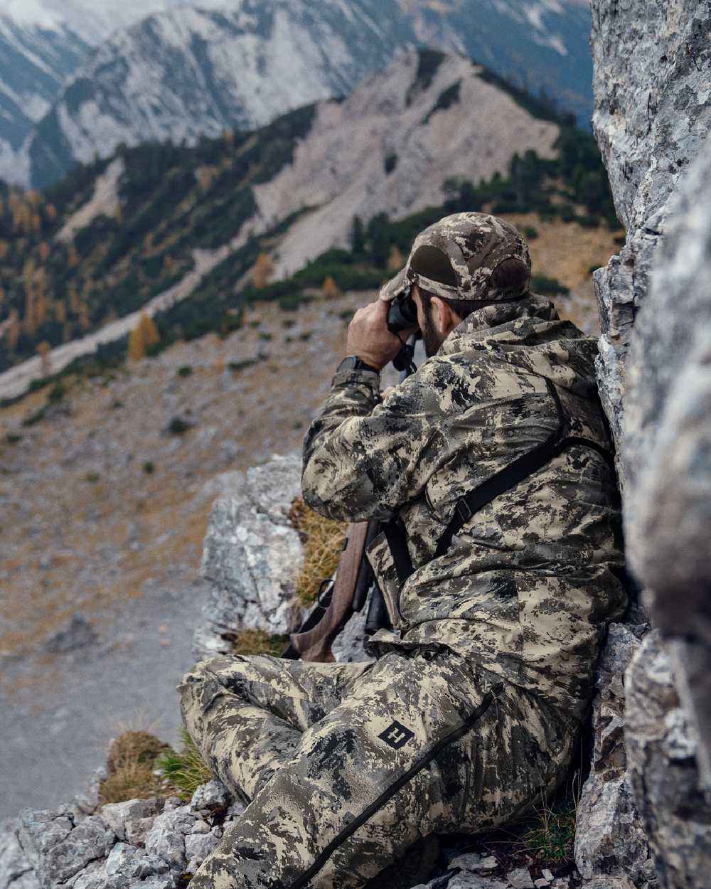 AXIS Mountain Coloured Harkila Mountain Hunter Expedition HWS Packable Jacket on outdoor background