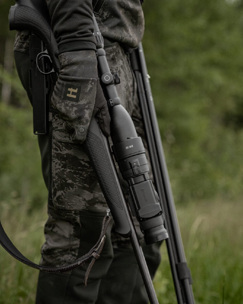 AXIS Black Black Coloured Harkila NOCTYX Camo Silent Trousers on outdoor background