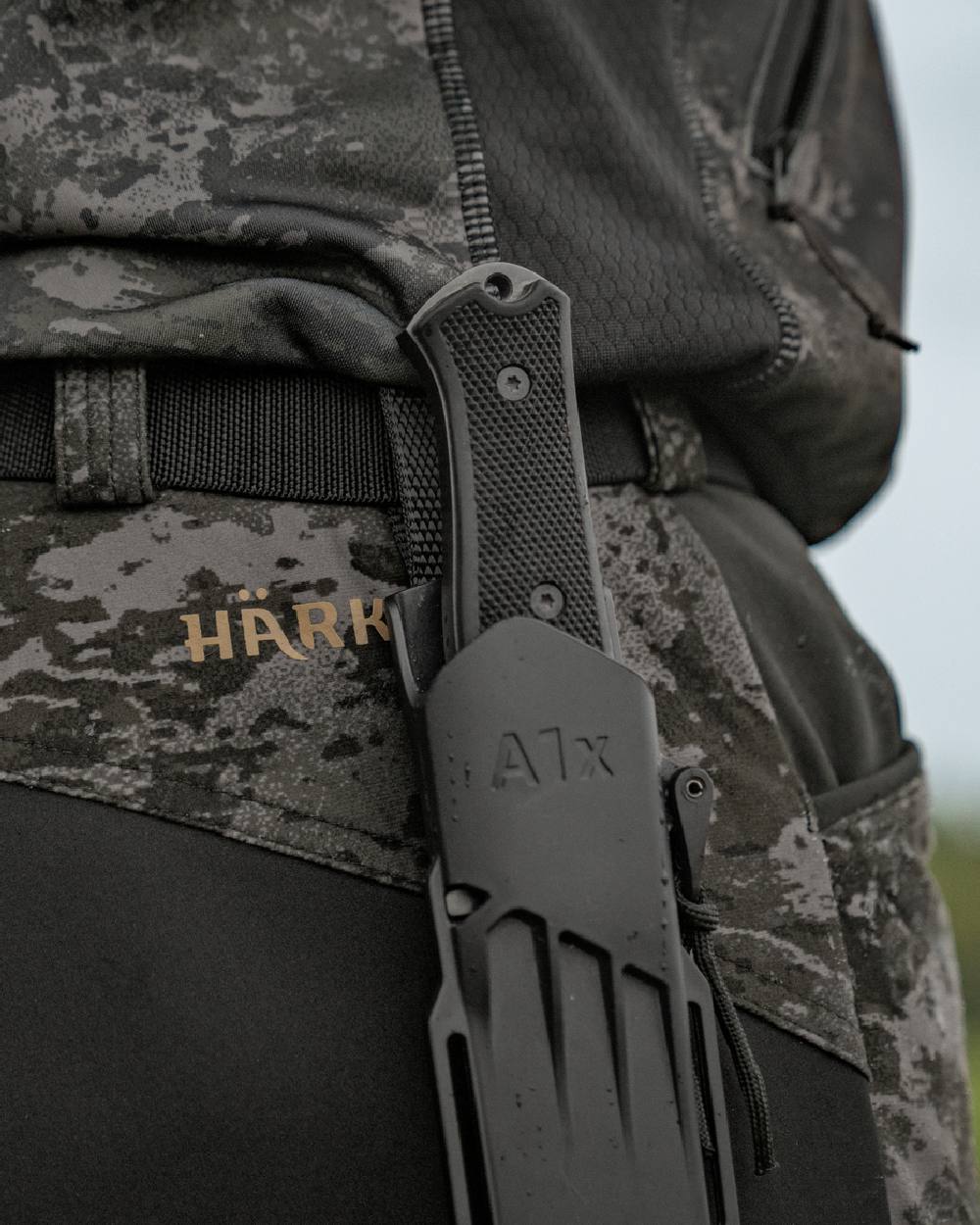 AXIS Black Black Coloured Harkila NOCTYX Camo Silent Trousers on outdoor background