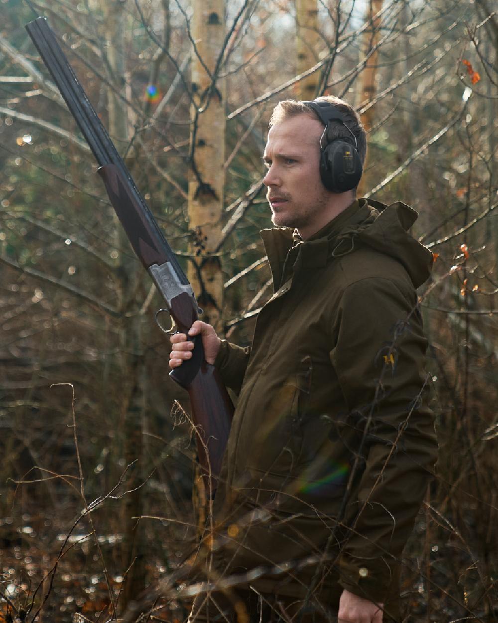 Willow Green Coloured Harkila Nordic Hunter HWS Jacket on outdoor background