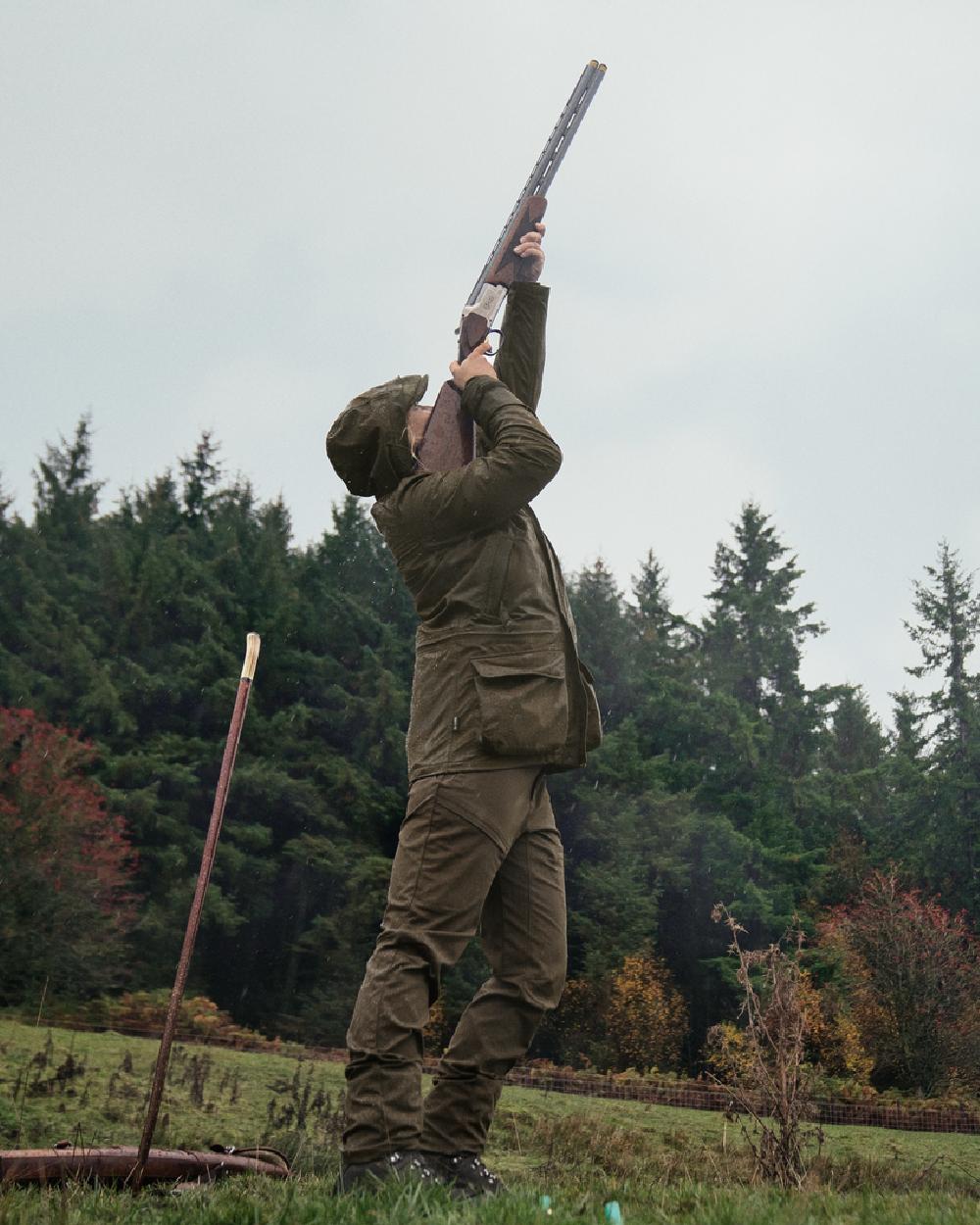 Willow Green Coloured Harkila Orton Packable Lady Jacket on outdoor background