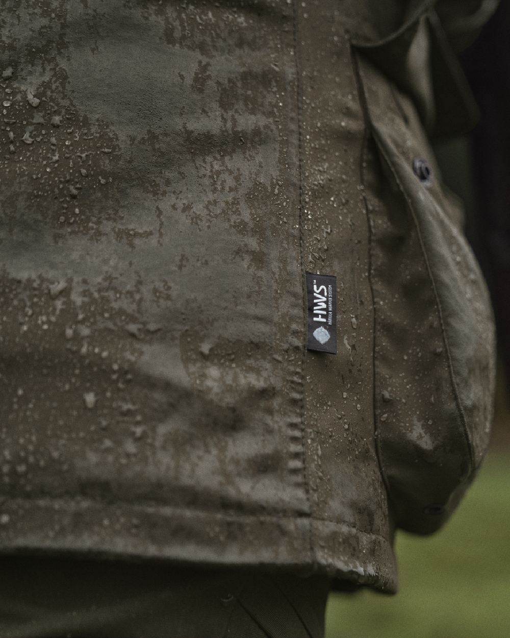 Willow Green Coloured Harkila Orton Packable Lady Jacket on outdoor background