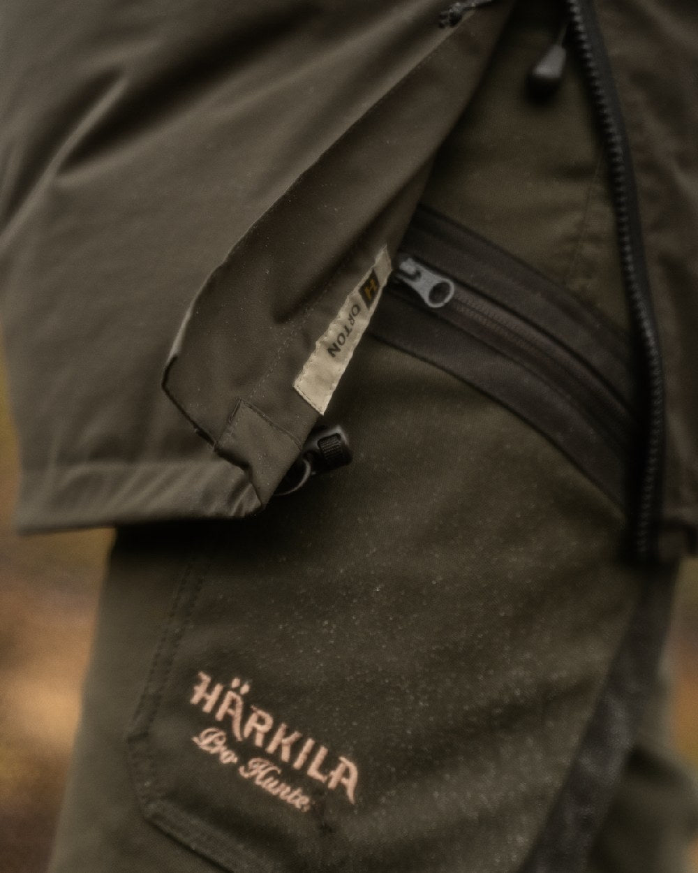 Willow Green Coloured Harkila Orton Tech HWS Packable Smock on outdoor background