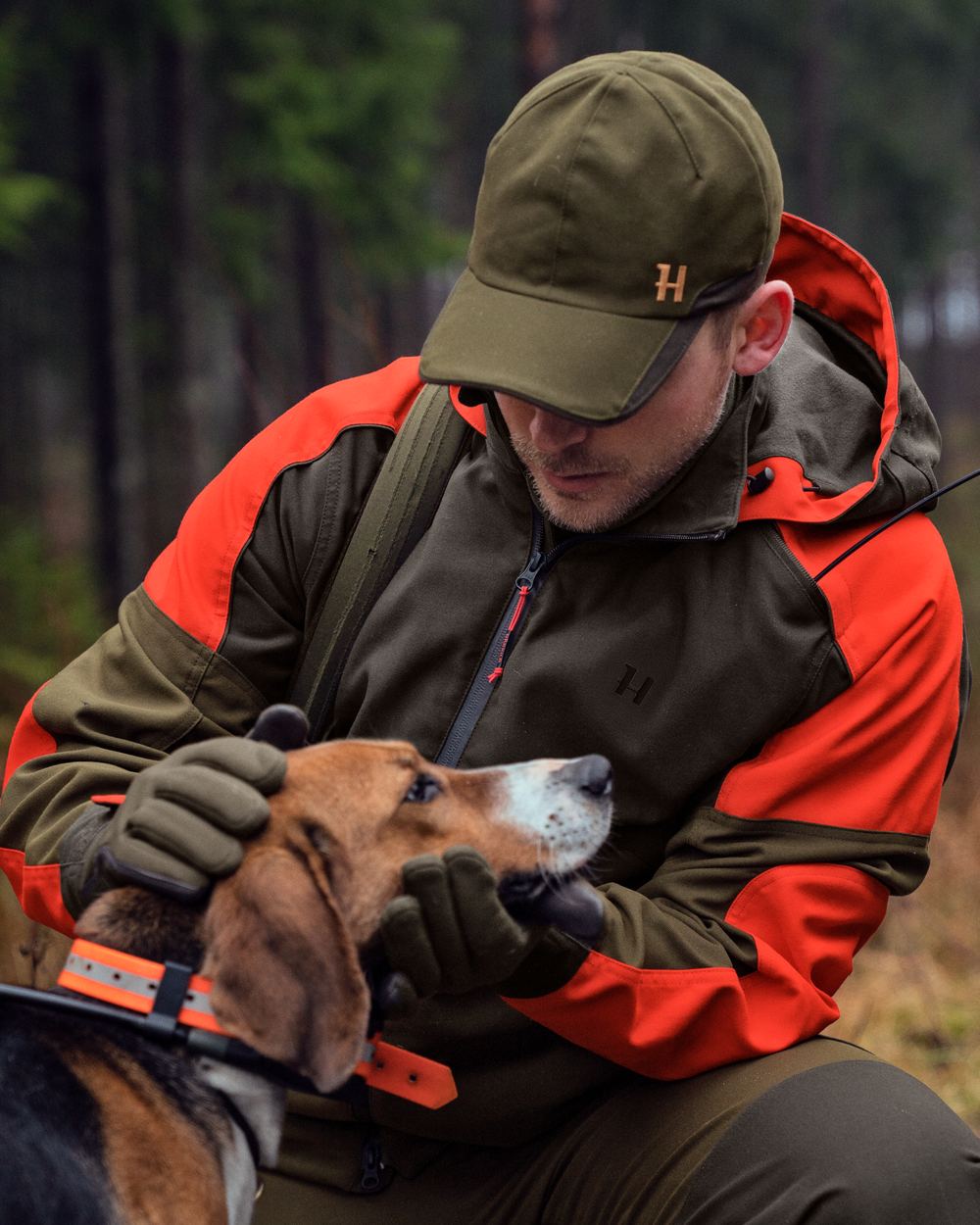 Willow Green Orange Coloured Harkila Pro Hunter Dog Keeper GTX Jacket on outdoor background