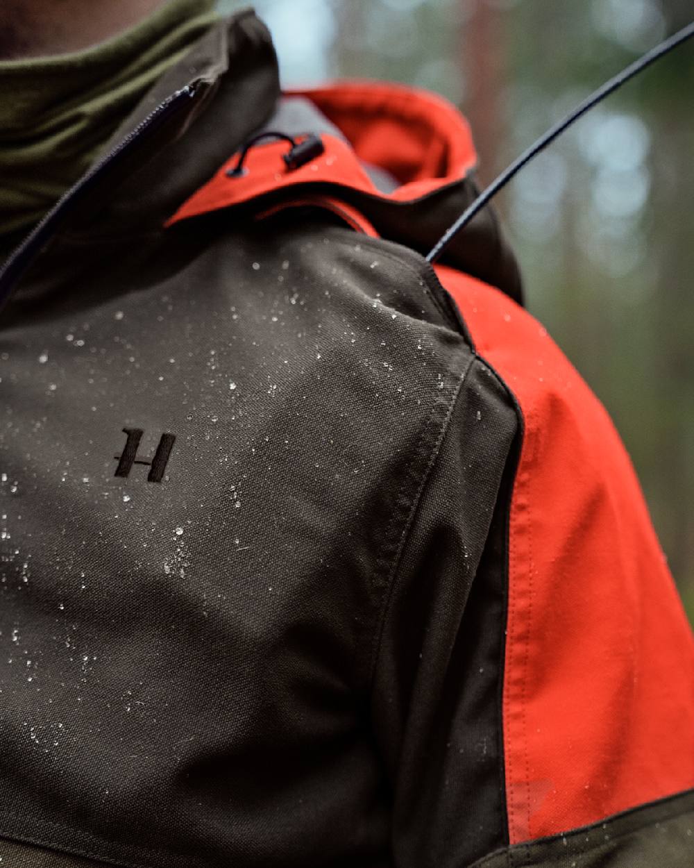 Willow Green Orange Coloured Harkila Pro Hunter Dog Keeper GTX Jacket on outdoor background