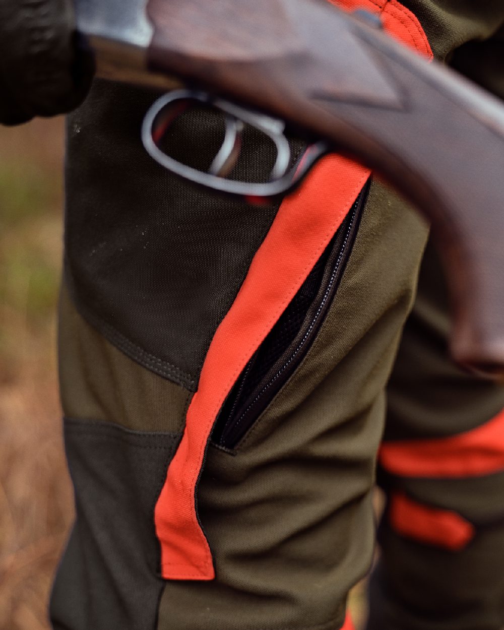 Willow Green Orange Coloured Harkila Pro Hunter Dog Keeper GTX Trousers on forest background