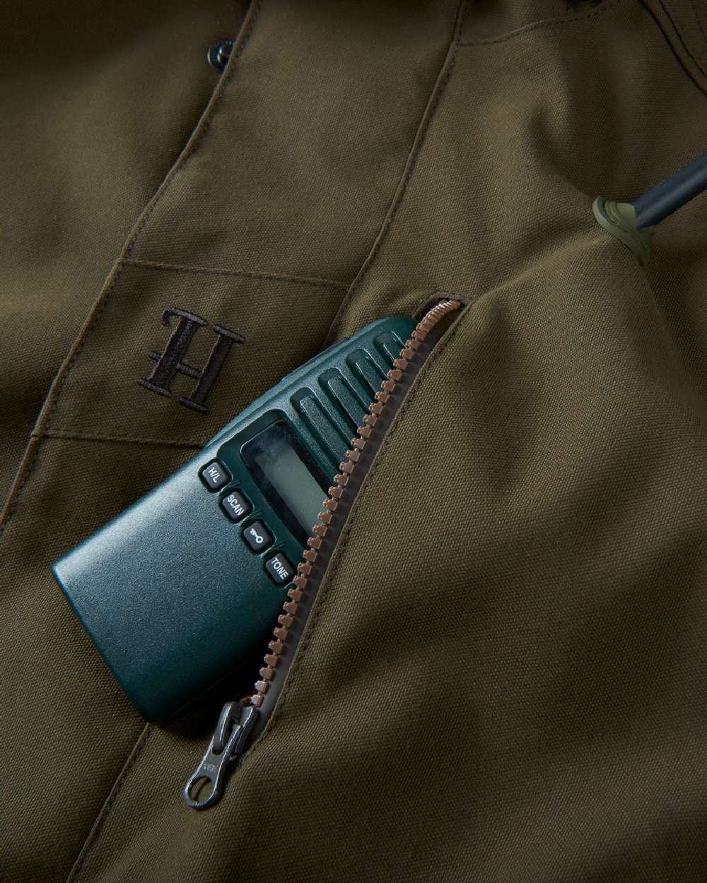 Willow Green Coloured Harkila Pro Hunter Endure Jacket on outdoor background