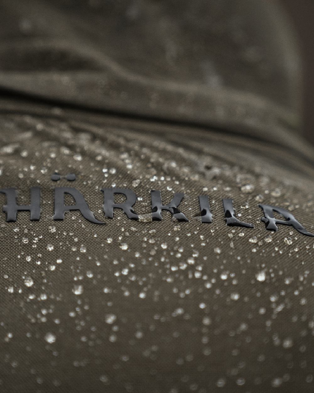 Willow Green Coloured Harkila Pro Hunter Shooting GTX Jacket on outdoor background